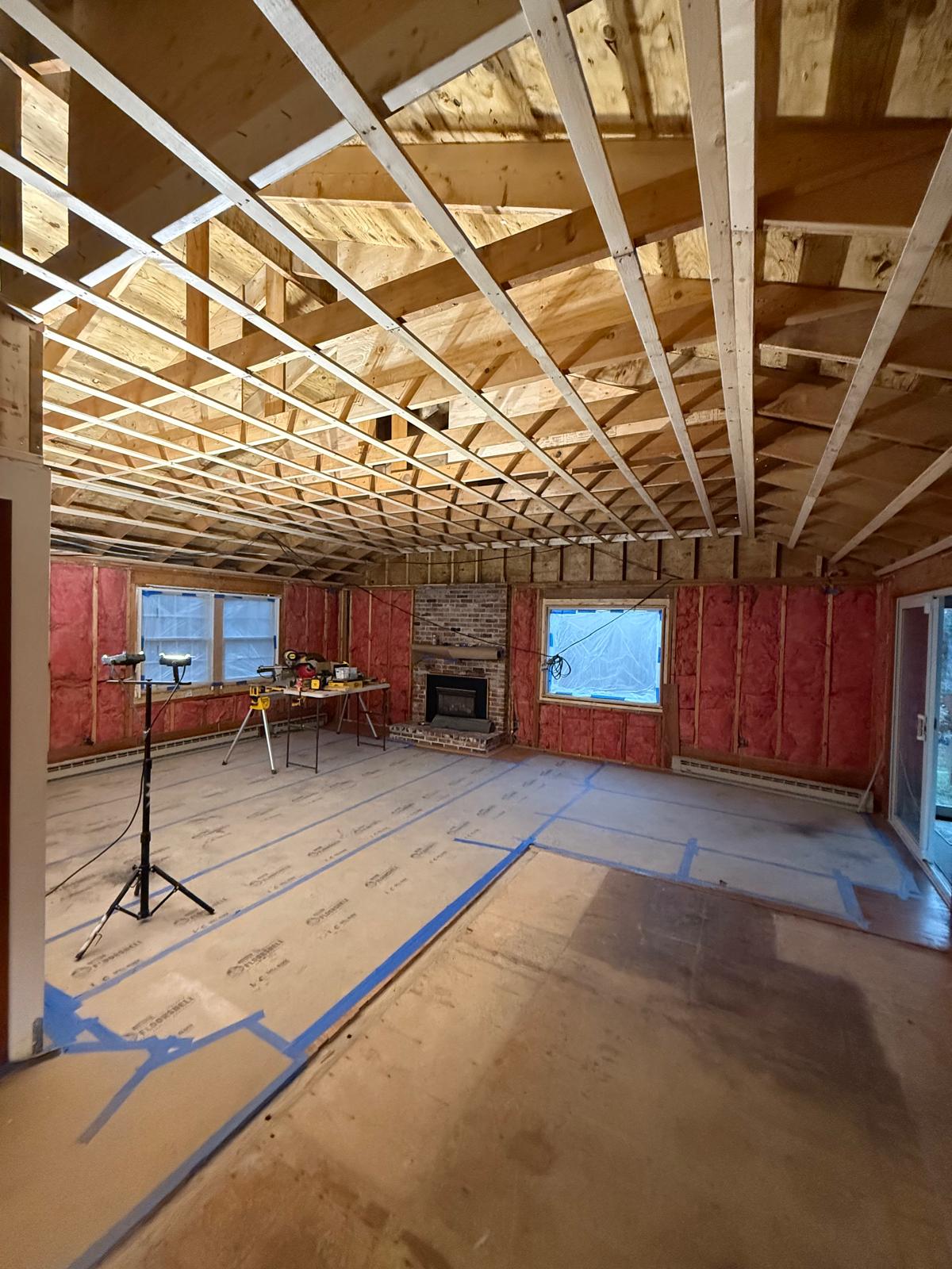 Framing and ceiling raise — full kitchen and living room remodel in progress