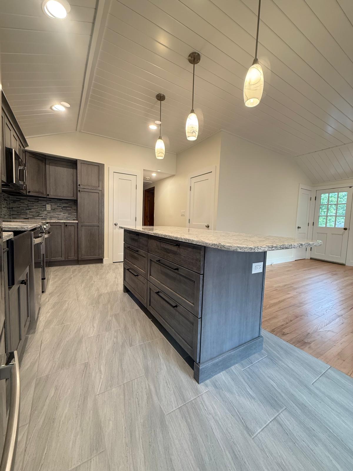 Vaulted shiplap ceiling above the new kitchen island
