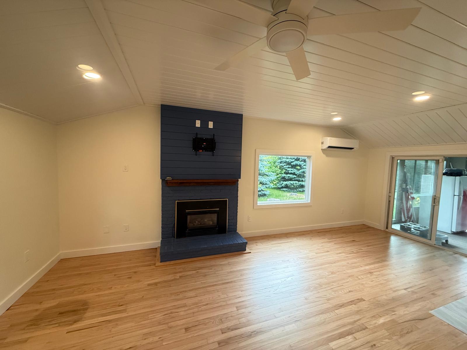 Shiplap ceiling and custom fireplace living room by Estevam Finish Carpentry