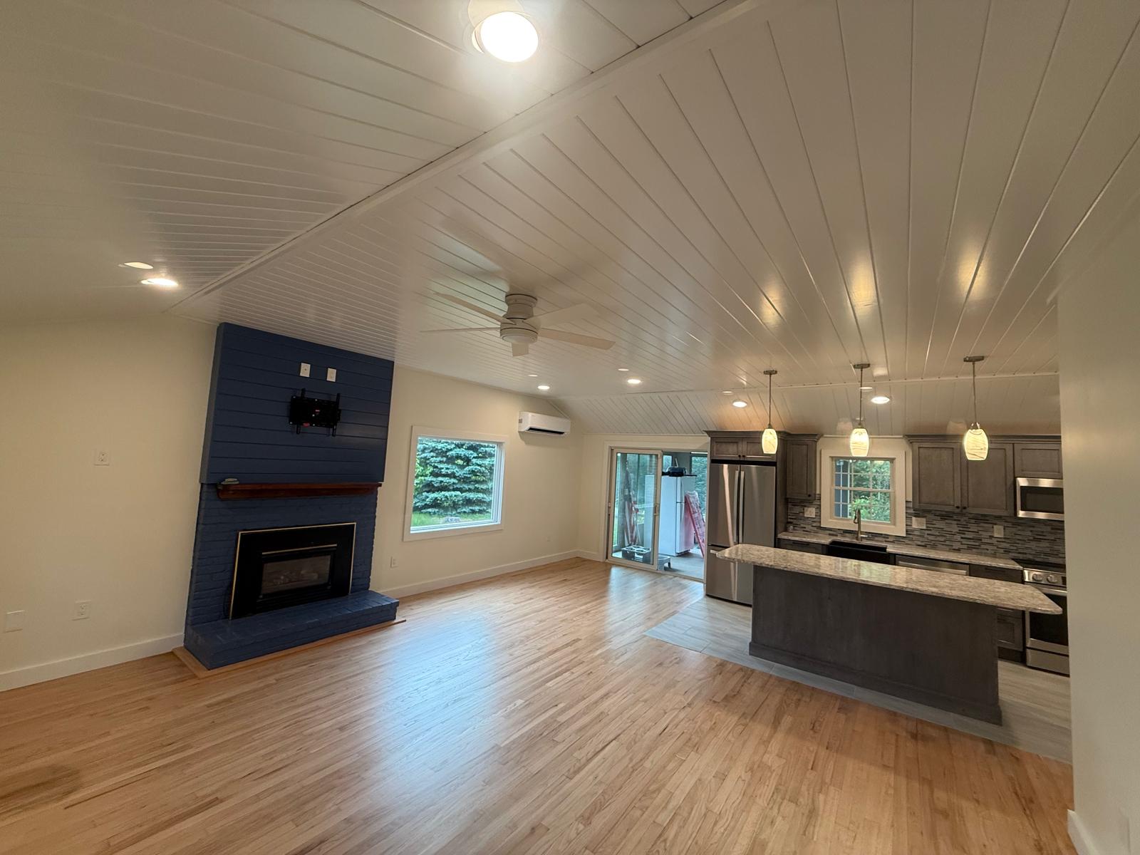 Shiplap fireplace feature wall with reclaimed wood mantel
