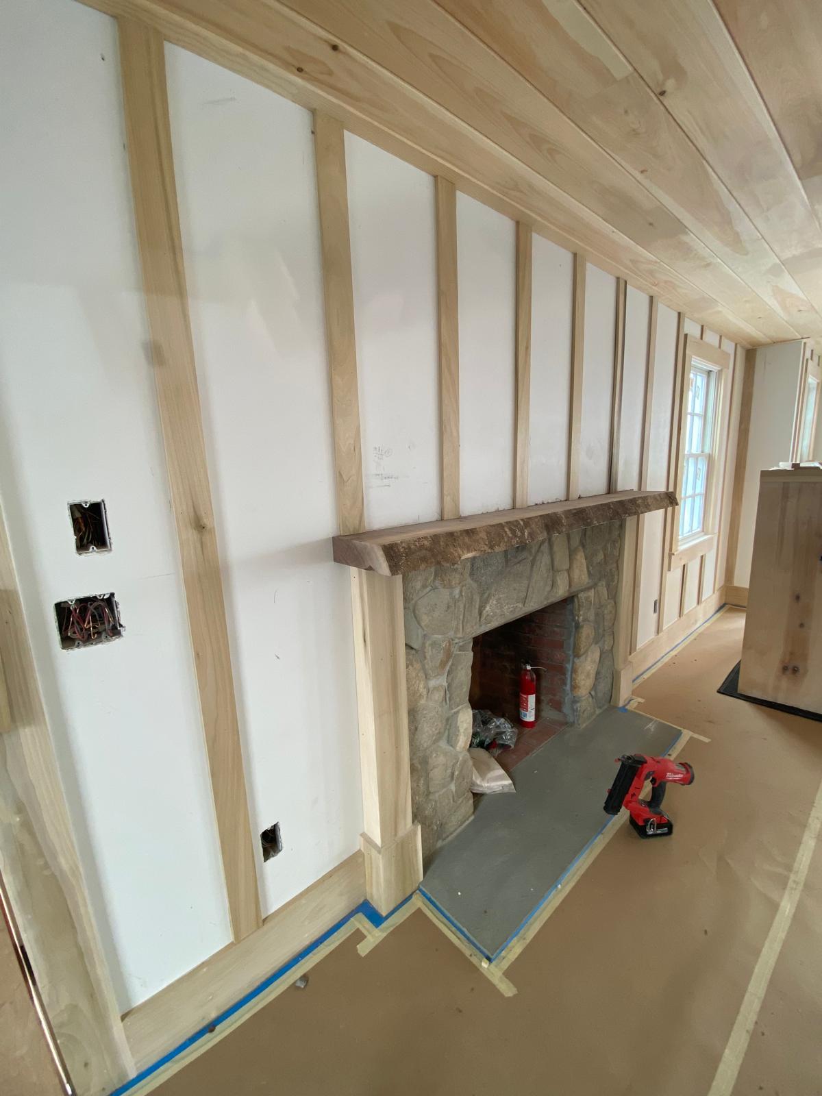 Side view — reclaimed wood mantel and vertical batten detail