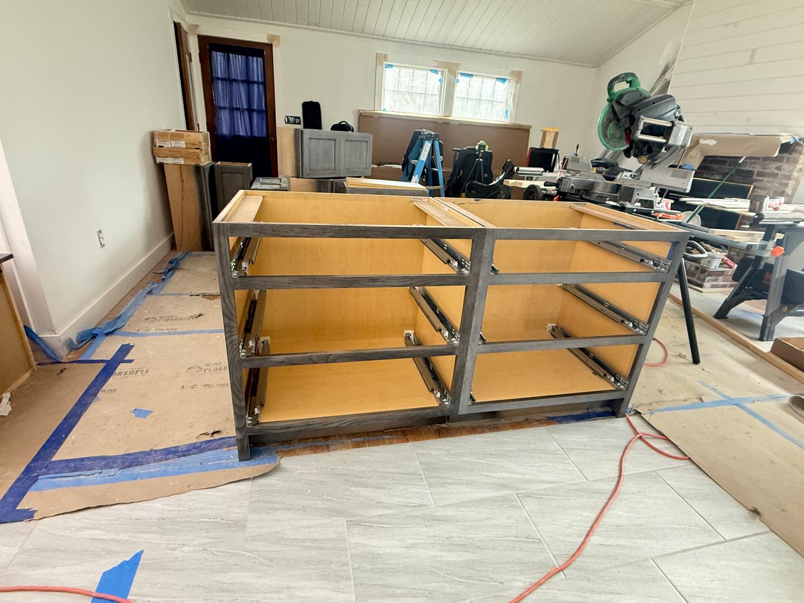 Custom kitchen island base being assembled on site