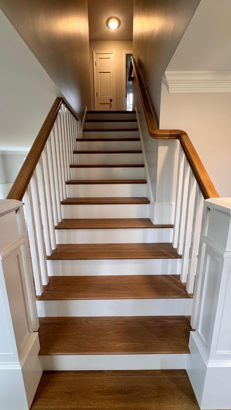 Finished oak staircase — stained treads and painted risers